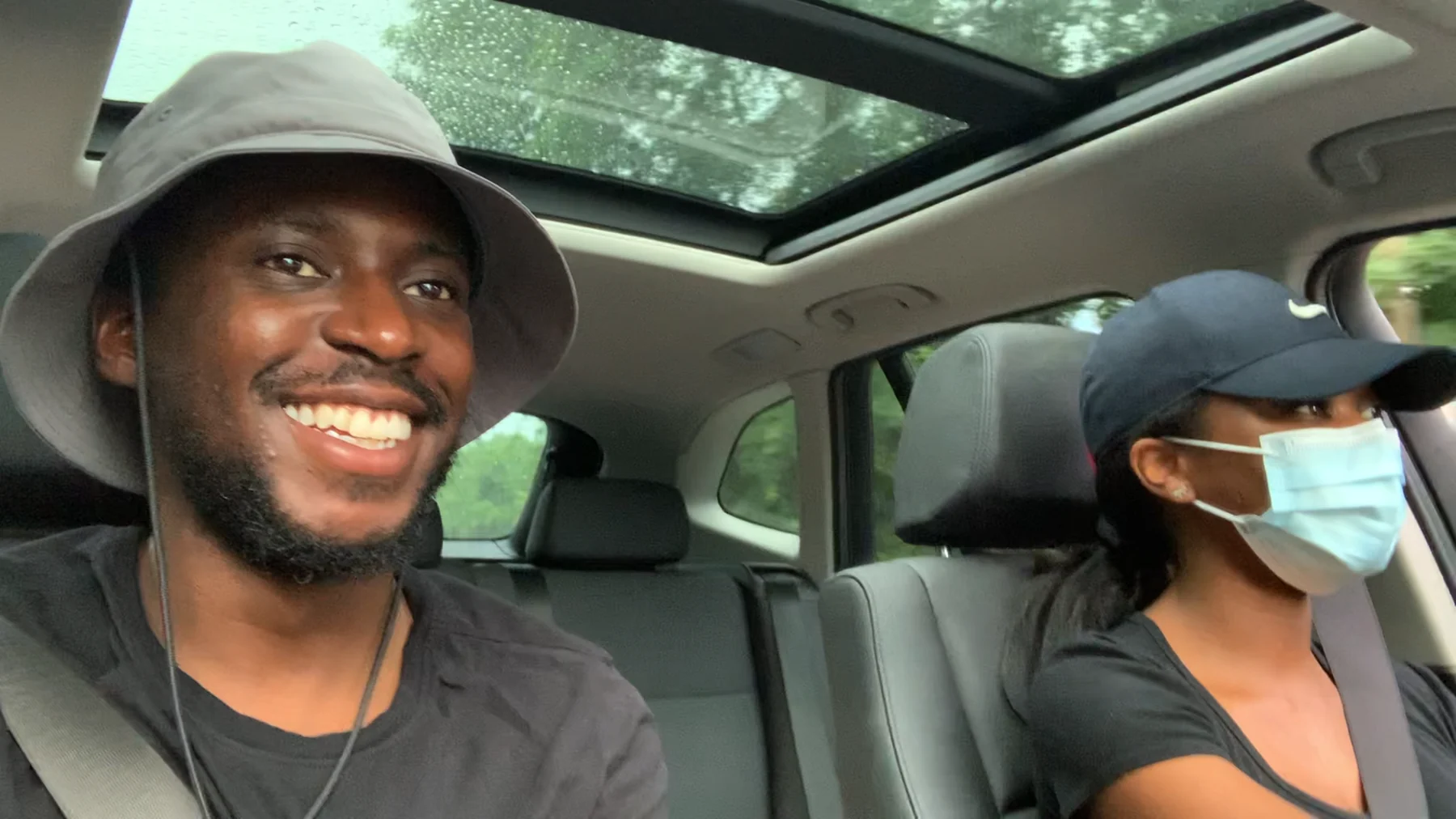 Gabriel riding in a car with a family member